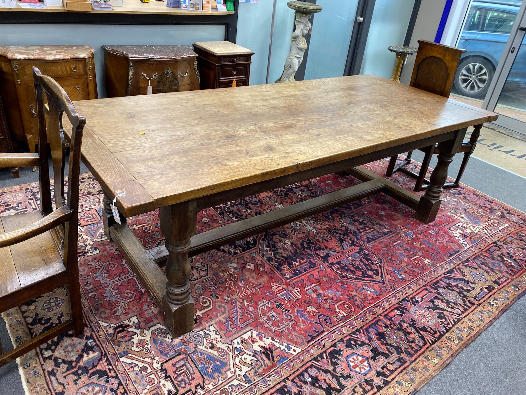 An 18th century style rectangular oak refectory dining table, length 242cm, width 106cm, height 80cm